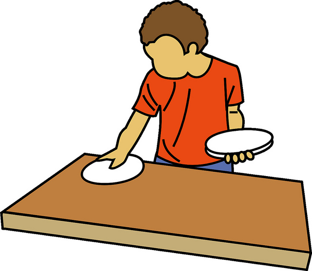 Children helping set the table clipart