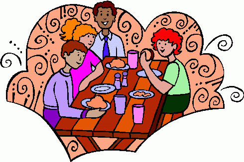 Family eating at a picnic table clipart