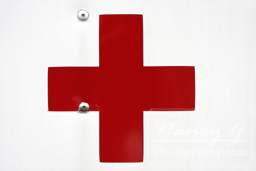 The Red Cross Symbol on the side of an ambulance vehicle. Means ...