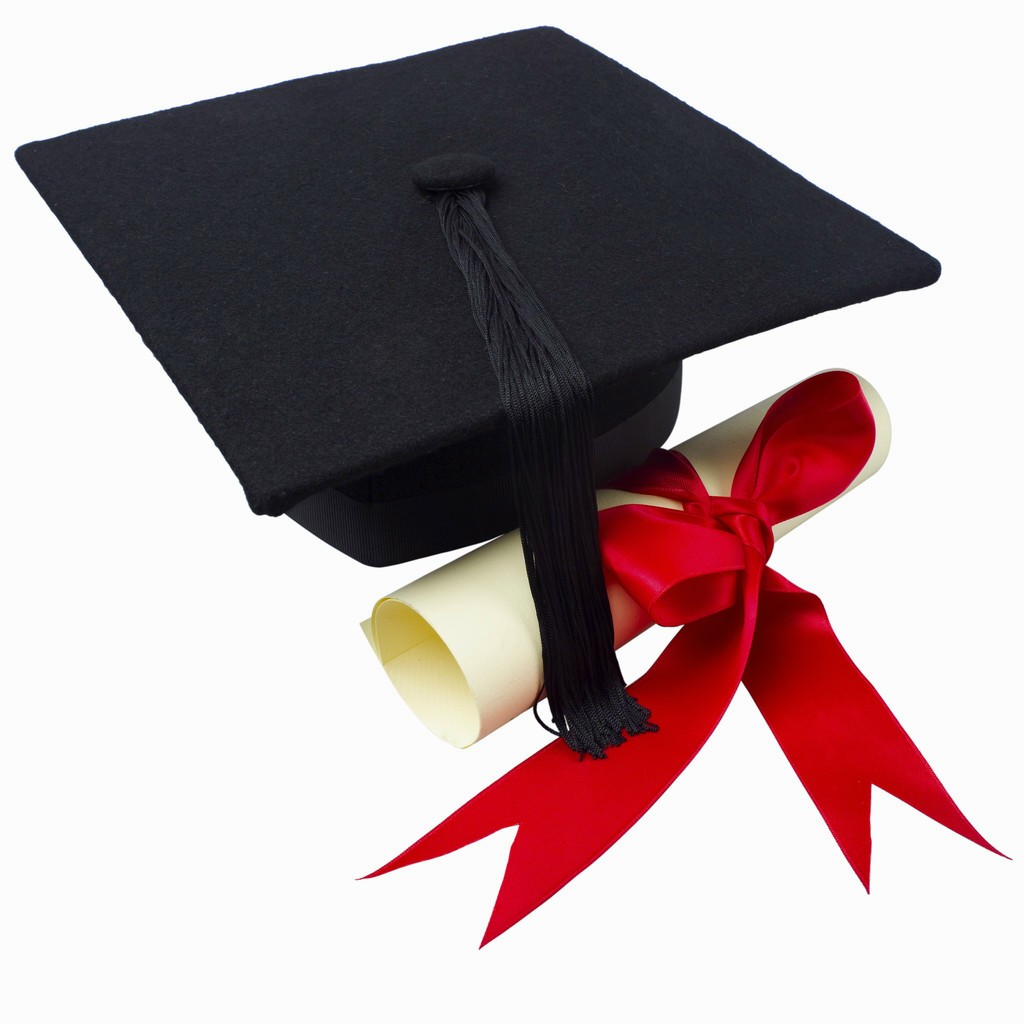 Close up of a graduation cap and a certificate with a ribbon ...