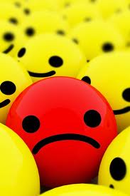 red sad face with lots of happy faces in yellow | Bagg Lady's Buzz