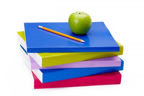 Pencil and apple on top of many books - stock photo free