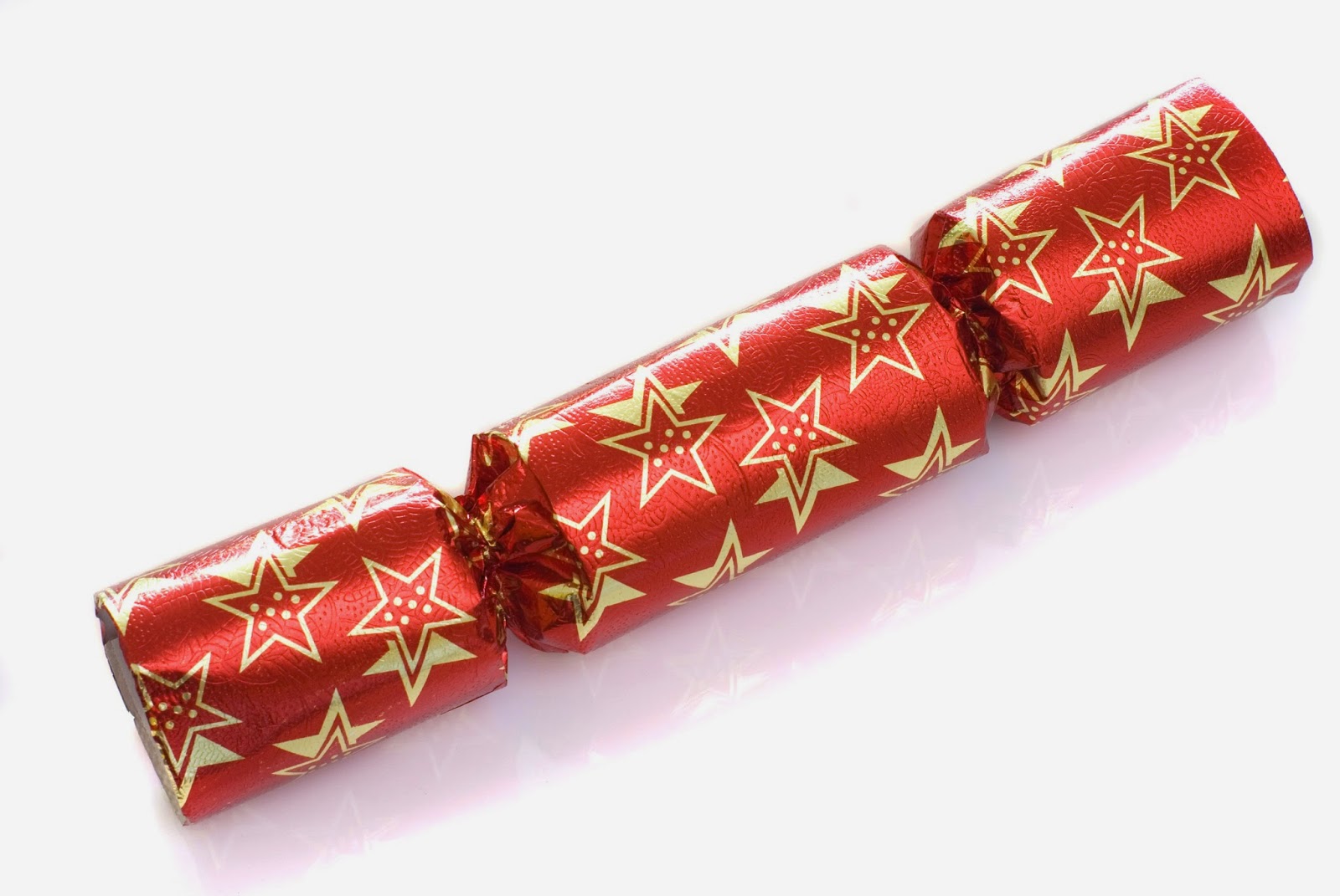 Christmas Crackers are used to decorate the table at Christmas dinner. A cracker is a small cardboard tube covered in a brightly coloured twist of paper.